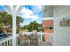 Balcony view of a cozy outdoor sitting area with a glimpse of the water at 113 8Th S St, Bradenton Beach, FL 34217