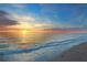 Beautiful beach at sunset with calming waves and a vibrant sky reflecting on the water at 113 8Th S St, Bradenton Beach, FL 34217