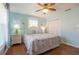 Serene bedroom with coastal decor, hardwood floors, and plenty of natural light at 113 8Th S St, Bradenton Beach, FL 34217