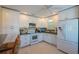 Bright kitchen with white cabinetry, modern appliances, and a convenient breakfast bar at 113 8Th S St, Bradenton Beach, FL 34217