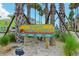 Charming Historic Bridge Street sign set amidst swaying palm trees, inviting exploration and discovery at 113 8Th S St, Bradenton Beach, FL 34217