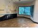 A room under repair featuring tile flooring and large bay windows at 11516 Sweetflag Dr, Lakewood Ranch, FL 34202