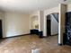 Spacious living room featuring tile flooring, archways, and the view of a staircase at 11516 Sweetflag Dr, Lakewood Ranch, FL 34202