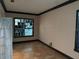 Room with neutral-colored walls, tile floors, and a window featuring decorative glass blocks at 11516 Sweetflag Dr, Lakewood Ranch, FL 34202