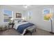 Light-filled bedroom with three windows, carpet, and a cozy queen bed at 11591 Little River Way, Parrish, FL 34219