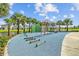 Outdoor fitness park with various workout stations and lush landscaping near a waterway at 11591 Little River Way, Parrish, FL 34219