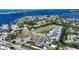 Aerial view of waterfront community showcasing location, waterways, and neighborhood layout at 12415 Dockside Ter, Cortez, FL 34215