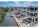 Aerial view of luxury waterfront homes, showcasing a serene canal, private pools and boat docks at 12415 Dockside Ter, Cortez, FL 34215