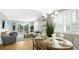 Open-concept living space with dining area, seating, and outdoor access at 12415 Dockside Ter, Cortez, FL 34215