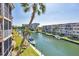 Aerial view of a waterfront condo community with boat docks and well-maintained landscaping at 1250 N Portofino Dr # 304, Sarasota, FL 34242