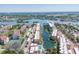 Beautiful aerial view of a waterfront condo community with boat docks and picturesque bay views at 1250 N Portofino Dr # 304, Sarasota, FL 34242