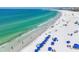 Panoramic view of the beach with white sand, blue water, and people enjoying the sunshine at 1250 N Portofino Dr # 304, Sarasota, FL 34242