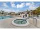 Community hot tub with condo buildings in the background and spa rules sign at 1250 N Portofino Dr # 304, Sarasota, FL 34242