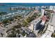 An aerial view shows buildings, a marina with boats, waterfront views, and tree lined streets at 1350 40Th St, Sarasota, FL 34234