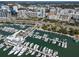 Stunning aerial view of a marina filled with boats, surrounded by city buildings and lush green spaces at 1350 40Th St, Sarasota, FL 34234