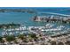 Panoramic aerial view of a marina, yachts, and waterfront buildings under a clear sky at 1350 40Th St, Sarasota, FL 34234