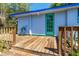 Outdoor deck with wooden floors, colorful accents, and partial shade, ideal for relaxation at 1350 40Th St, Sarasota, FL 34234