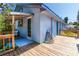 Outdoor deck with wooden floors, colorful accents, and partial shade, great for relaxation at 1350 40Th St, Sarasota, FL 34234