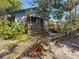 A charming home featuring a spacious deck, landscaped yard, and lush surroundings at 1350 40Th St, Sarasota, FL 34234