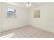 Comfortable bedroom with tiled floors, and natural light from two windows at 1350 40Th St, Sarasota, FL 34234
