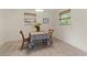 Bright dining area with tile flooring, two windows and a table set for two at 1350 40Th St, Sarasota, FL 34234