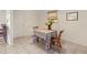 Cozy dining area with tile floors, a patterned tablecloth, and natural light from the window at 1350 40Th St, Sarasota, FL 34234