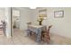 Bright dining room with table, chairs, and view into laundry room with a door to close it off at 1350 40Th St, Sarasota, FL 34234