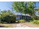 Cozy home surrounded by lush greenery and mature trees at 1350 40Th St, Sarasota, FL 34234