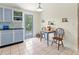 Bright kitchen with blue cabinets, stylish backsplash, and a door leading to the outdoors at 1350 40Th St, Sarasota, FL 34234