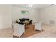 Bright and airy living space, boasting tile floors and neutral walls with a dark green couch at 1350 40Th St, Sarasota, FL 34234