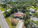 Single story home with a screened in pool, mature landscaping, and private driveway at 1621 Overbrook Rd, Englewood, FL 34223