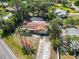 Single story home with a screened in pool, mature landscaping, and private driveway at 1621 Overbrook Rd, Englewood, FL 34223