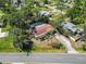 Charming single-story home features a screened-in pool, pergola, and mature landscaping at 1621 Overbrook Rd, Englewood, FL 34223