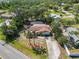 Aerial view of a charming single-story home surrounded by mature trees at 1621 Overbrook Rd, Englewood, FL 34223