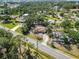 Charming single-story home with a private screened pool and lush landscaping at 1621 Overbrook Rd, Englewood, FL 34223