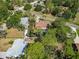Home featuring a refreshing pool and mature trees providing ample shade and privacy at 1621 Overbrook Rd, Englewood, FL 34223