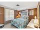 This stylish bedroom features ample natural light and a coastal theme at 1621 Overbrook Rd, Englewood, FL 34223