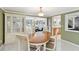 Dining area features a wooden table with seating for six and has an adjacent display cabinet at 1621 Overbrook Rd, Englewood, FL 34223