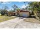 Inviting single-story home featuring a well-kept lawn, driveway and garage at 1621 Overbrook Rd, Englewood, FL 34223