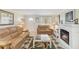 Cozy living room featuring a decorative fireplace, tile flooring, and neutral paint at 1621 Overbrook Rd, Englewood, FL 34223