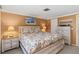 Inviting main bedroom featuring coastal decor, a king-size bed, and ample space at 1621 Overbrook Rd, Englewood, FL 34223