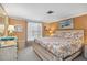 Bright bedroom with coastal-themed decor, king bed, and a window for natural light at 1621 Overbrook Rd, Englewood, FL 34223