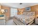 Serene bedroom with a king-size bed, coastal-inspired bedding, and a bright window at 1621 Overbrook Rd, Englewood, FL 34223