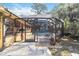 Screened-in pool enclosure with outdoor seating and view of pool at 1621 Overbrook Rd, Englewood, FL 34223