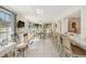 Bright sunroom offering plenty of natural light, and a breakfast bar connecting to the kitchen at 1621 Overbrook Rd, Englewood, FL 34223