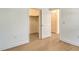 Bedroom featuring a walk-in closet and stylish hardwood flooring at 18249 Vizcaya Ct, Venice, FL 34293