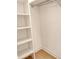 Walk-in closet featuring built-in shelving for storage and organization at 18249 Vizcaya Ct, Venice, FL 34293