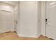 Hallway showcasing modern doors and sleek hardwood flooring at 18249 Vizcaya Ct, Venice, FL 34293