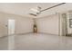 Spacious garage with a finished floor and access to the home at 18249 Vizcaya Ct, Venice, FL 34293