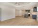 Bright, open kitchen with stainless steel appliances and a large island and light hardwood floors at 18249 Vizcaya Ct, Venice, FL 34293